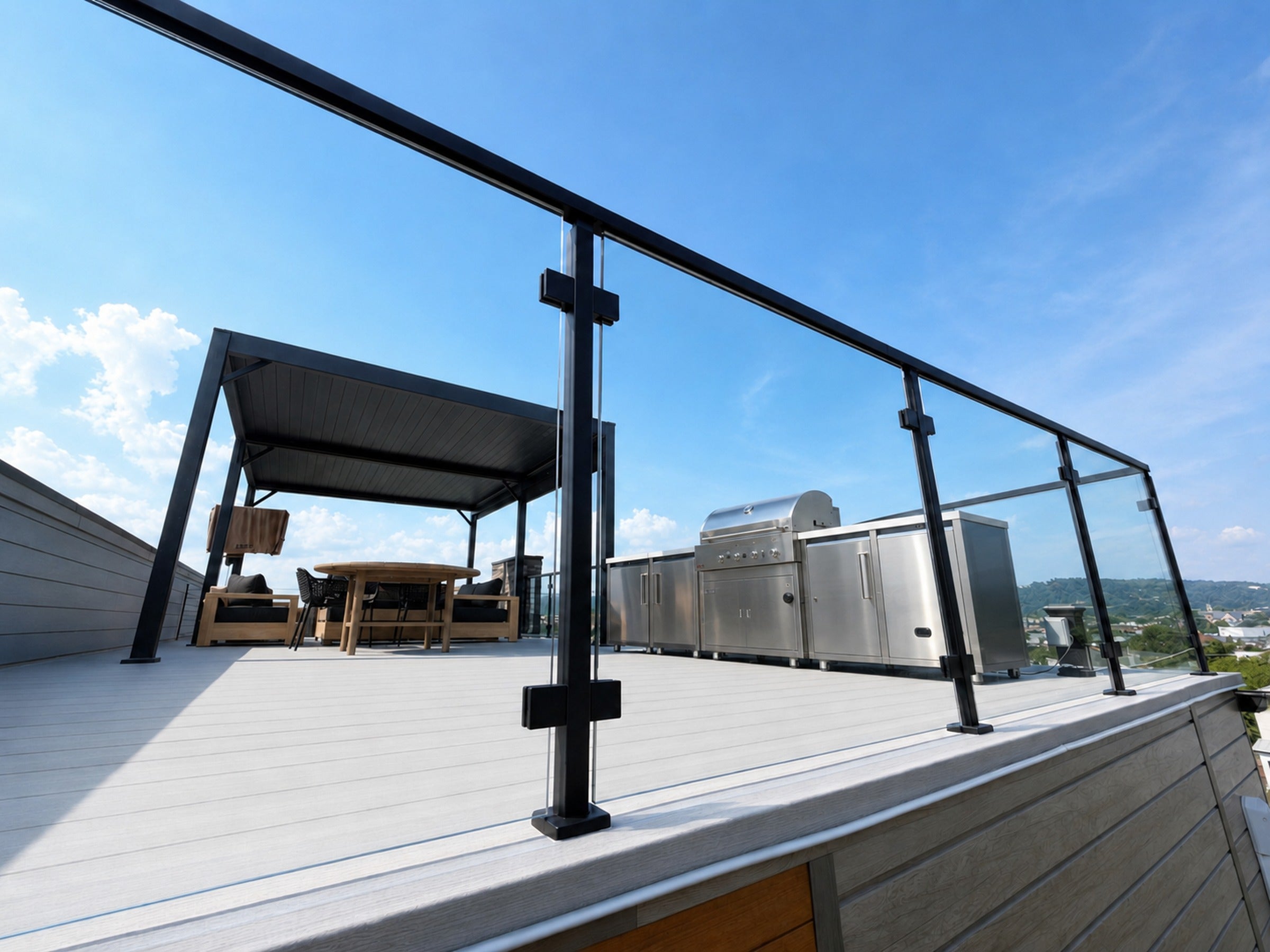 Black matte square post and glass clamp with pergola dining area in the background