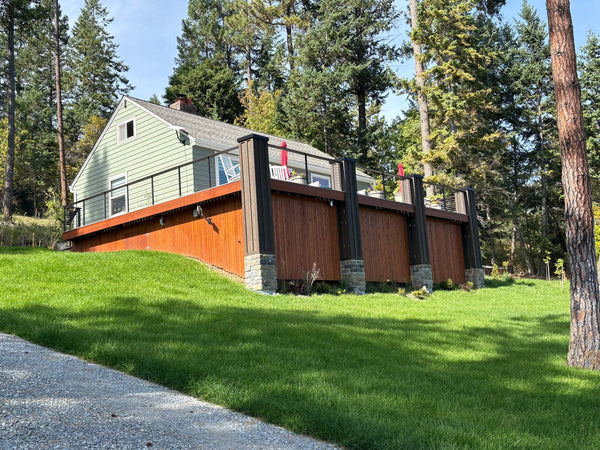Exterior view of an elevated deck with black cable railing