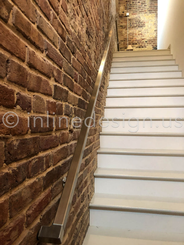 stairs handrail brick wall
